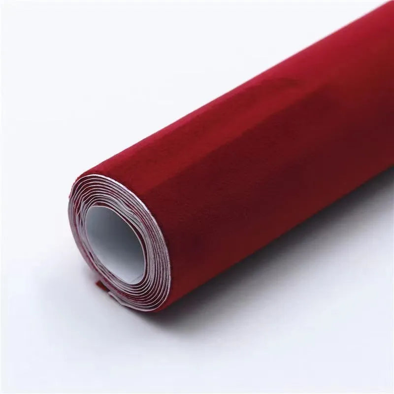 A sheet of self-adhesive black leather suede material with a ruler showing its 0.5mm thickness.
