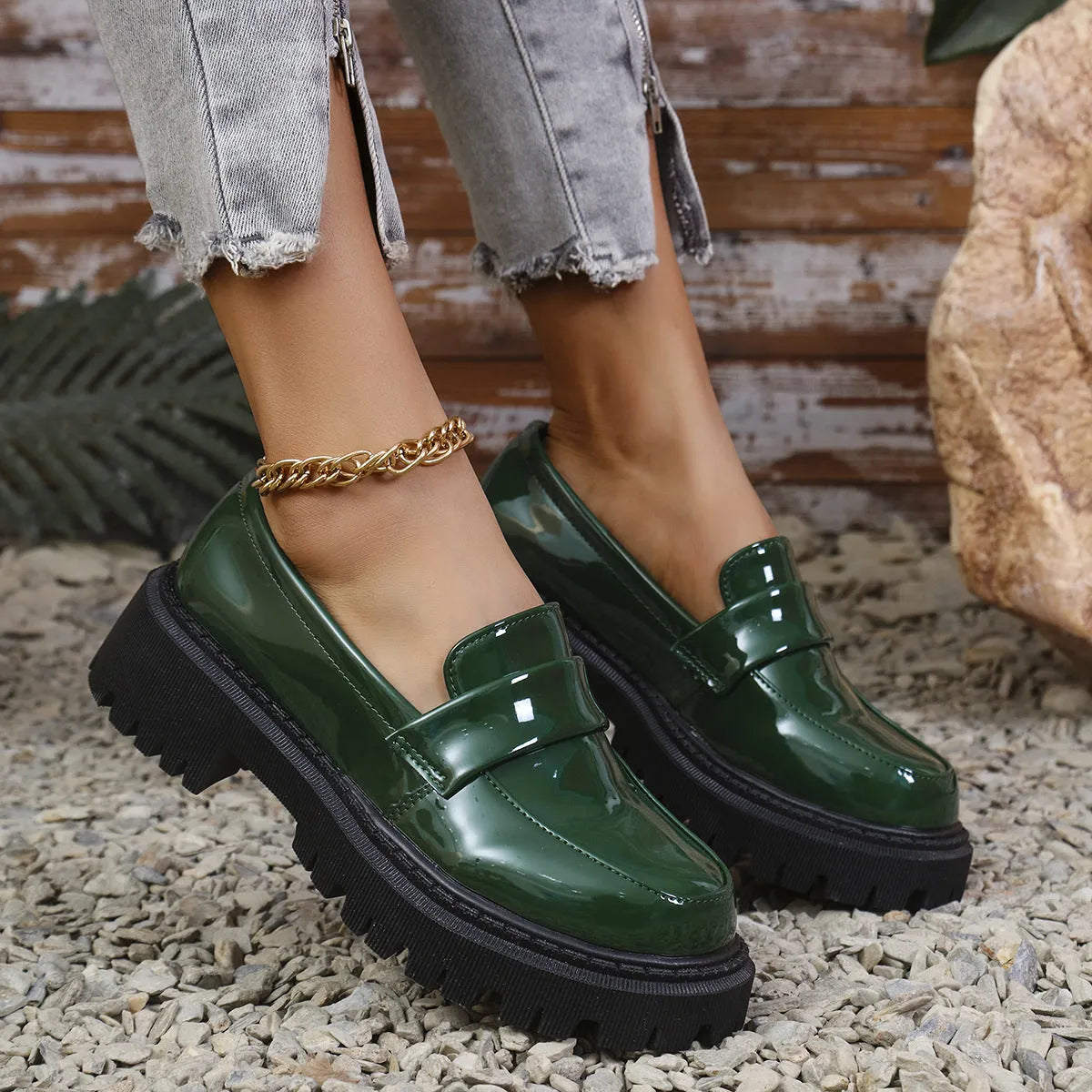 Plus size women's black slip-on loafers with a chunky mid-heel and thick rubber sole.