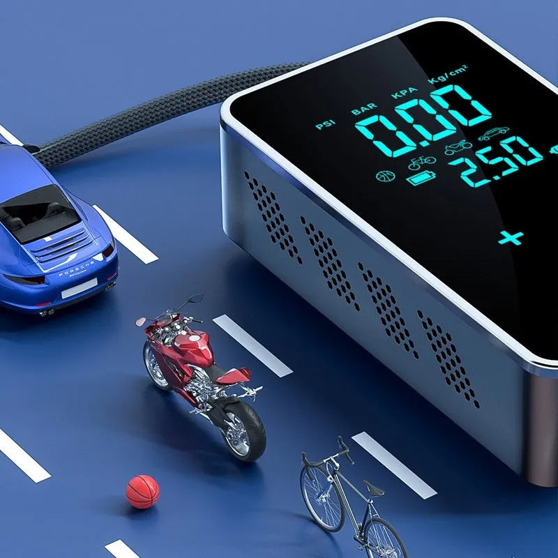 Compact black wireless car tyre pump with LCD screen displayed next to its hose, nozzles, and Type-C charging cable.