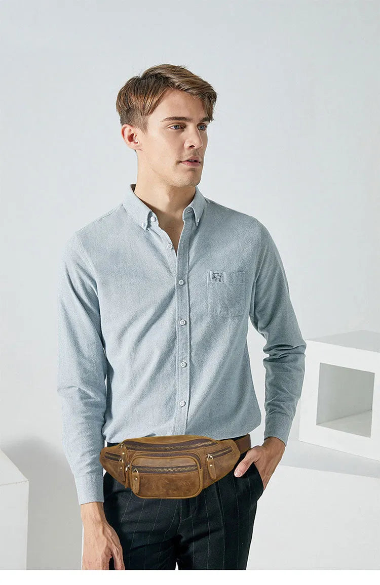 Brown leather retro messenger bag with single shoulder strap showing front compartment and silver hardware