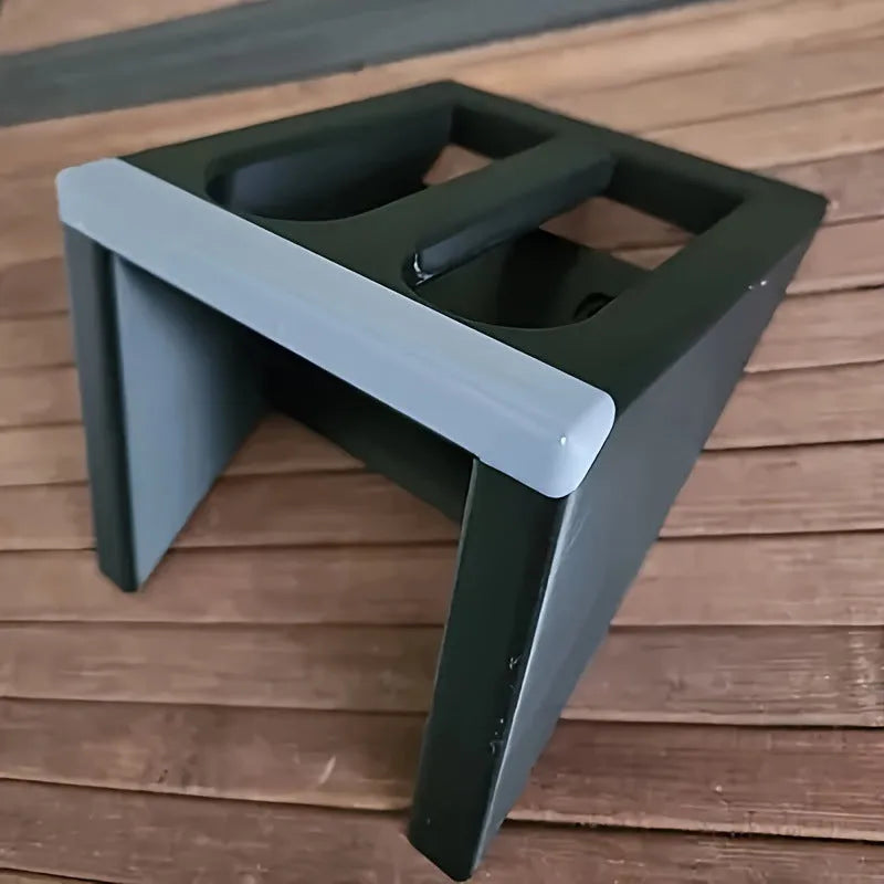 Black plastic pistol stand with punk-style finish for displaying collectible handguns