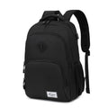 Gray nylon backpack with USB charging port and trolley sleeve on a suitcase.