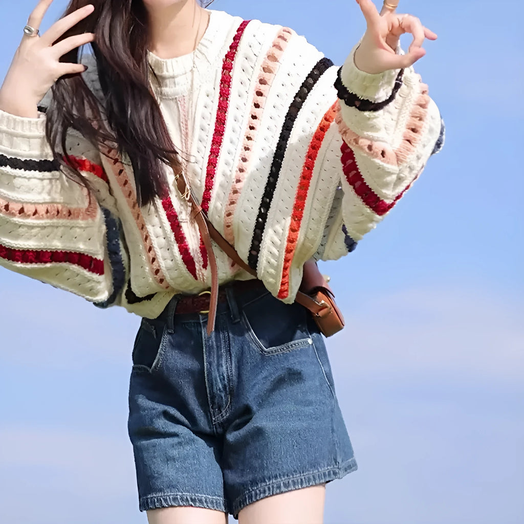 Colourful rainbow striped loose-fitting sweater with batwing sleeves and round neck