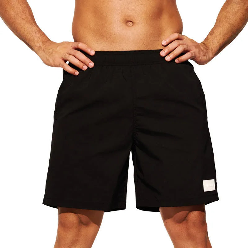 Men's quick-drying nylon sports shorts in blue with straight leg opening for beach and gym wear