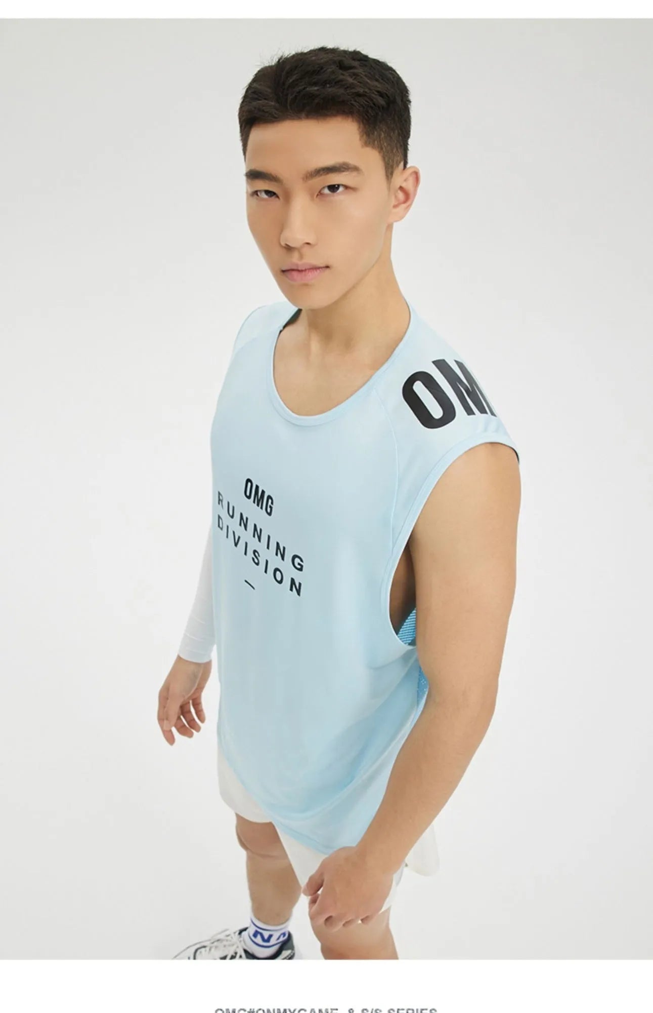 Man's loose-fitting mesh sports vest in blue, shown from the front.