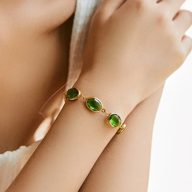 Women's geometric bracelet with elliptical glass inlays on 18K gold-copper framework