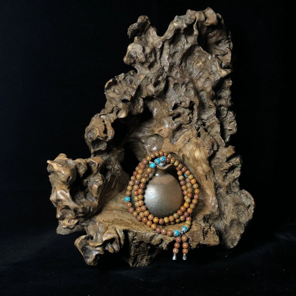 Handmade 108-bead lvzhu stone bracelet with 5-6mm geometric beads on wrist