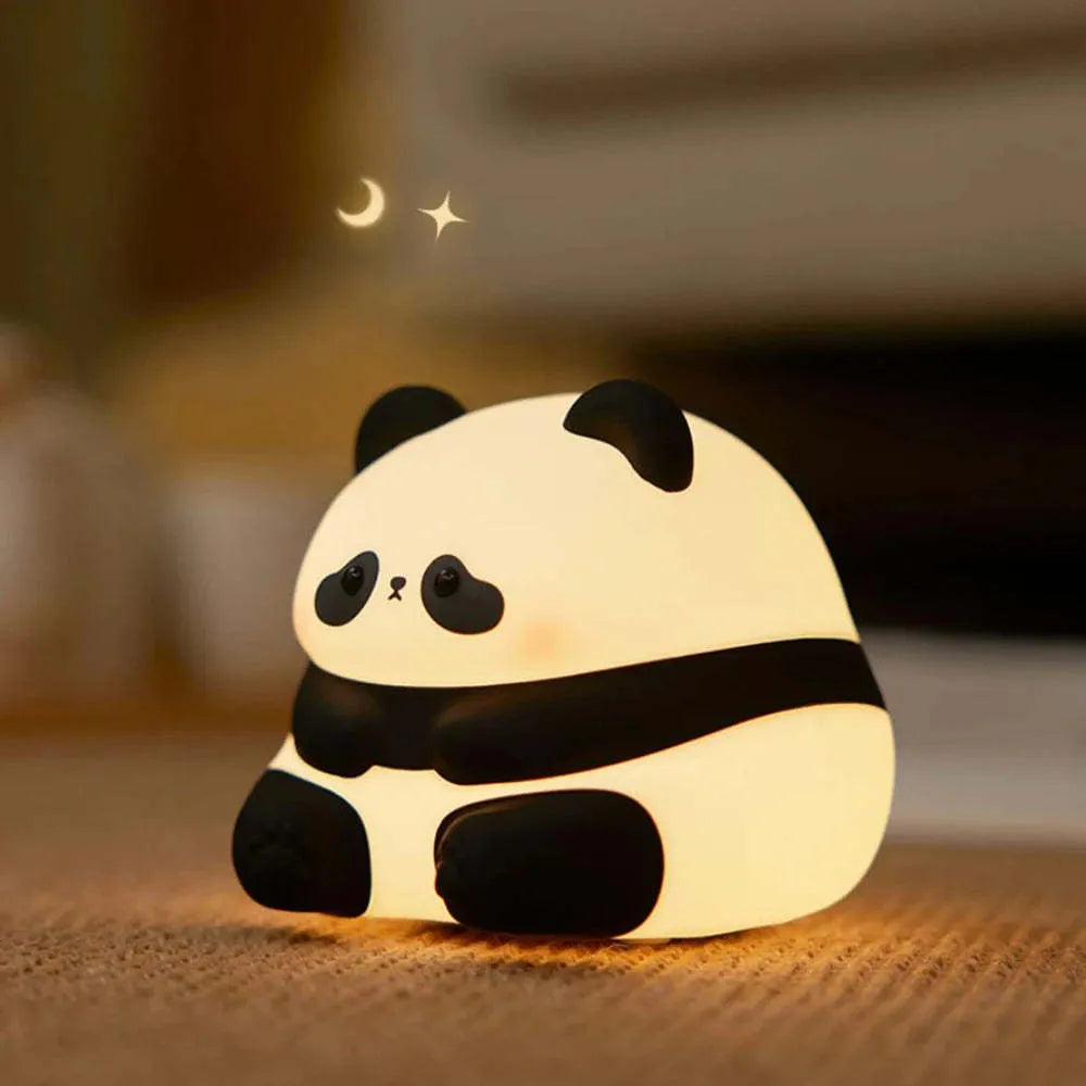 Cartoon panda head rechargeable night light with warm white glow on bedside table