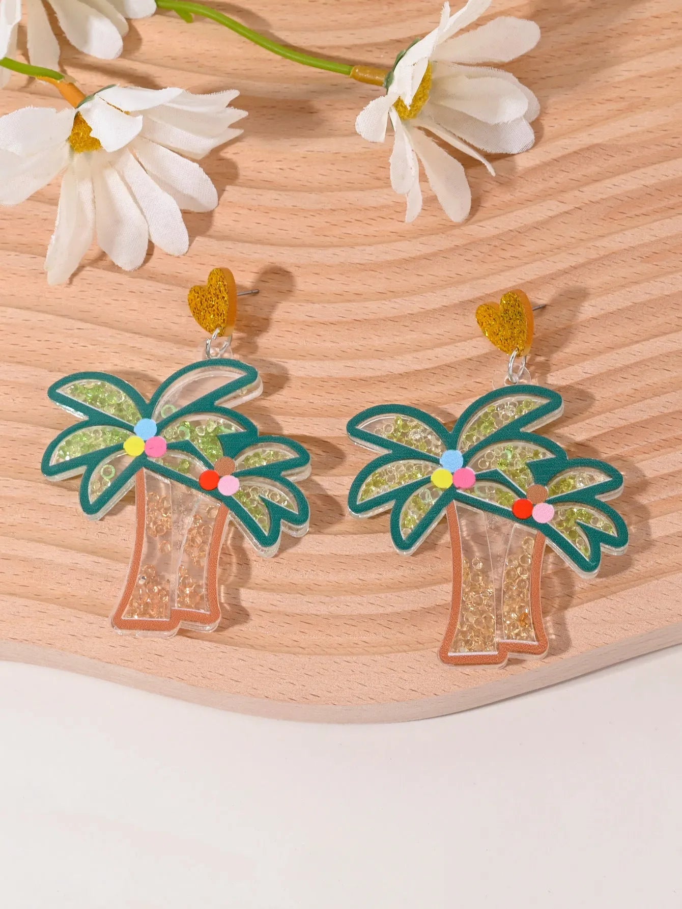 Colourful acrylic fruit and ice cream dangle earrings for women on a white background.