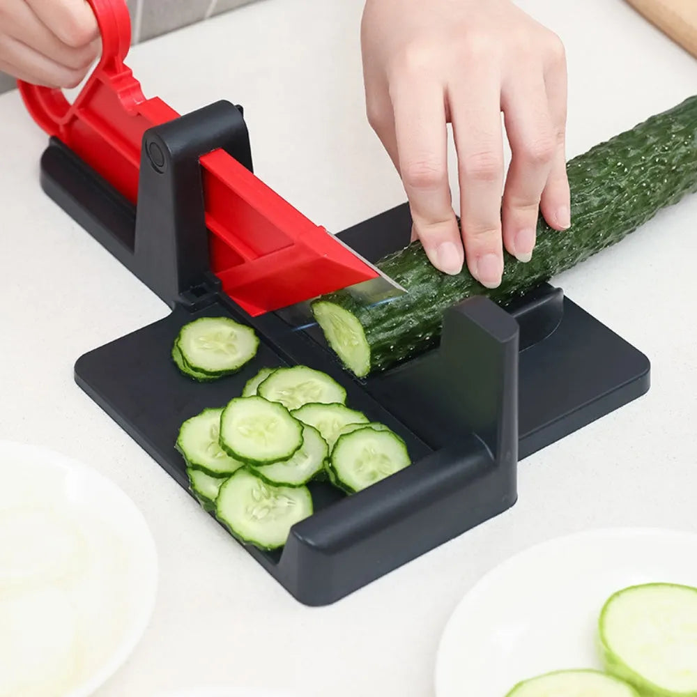 Green and red modern vegetable cutter with stainless steel blades for slicing carrots and potatoes.