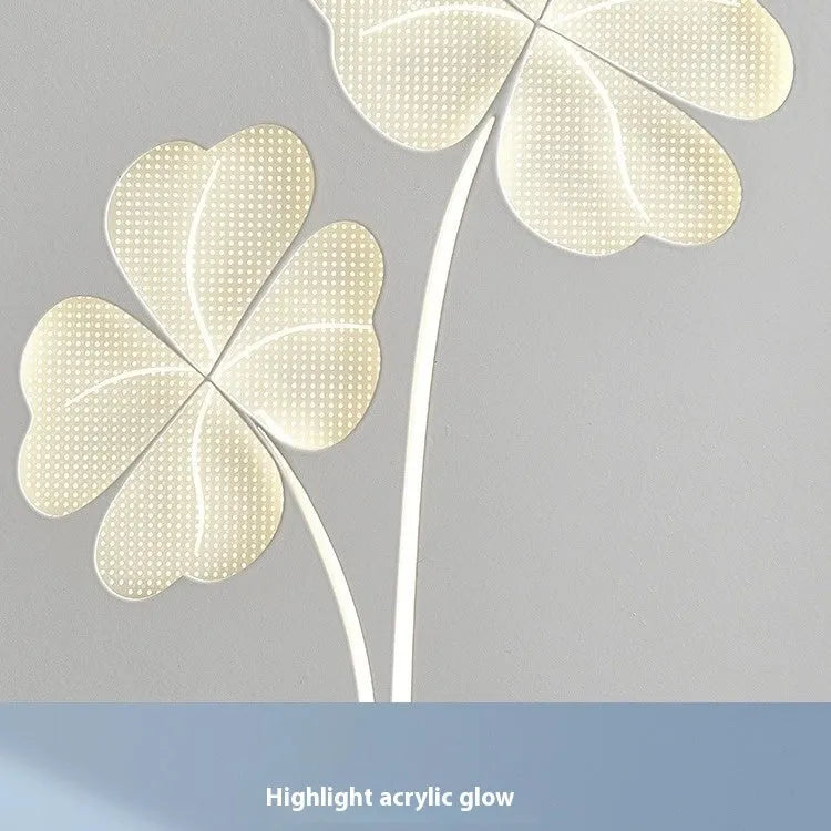 Modern bedside lamp with an acrylic shade showing a love heart motif and three-colour LED light.
