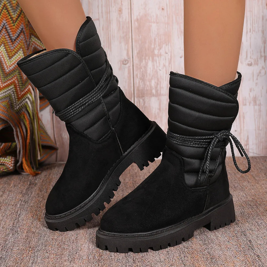 Women's black chunky heel snow boots with lace-up design and fleece lining