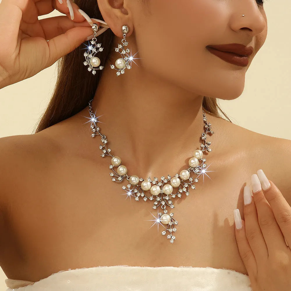 Women's fashion necklace and earrings set in gold or white with alloy construction and floral pattern