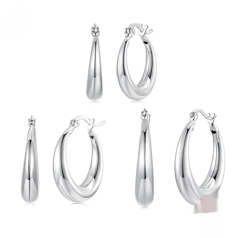 Women's geometric ring clip earrings in silver finish, available in three sizes