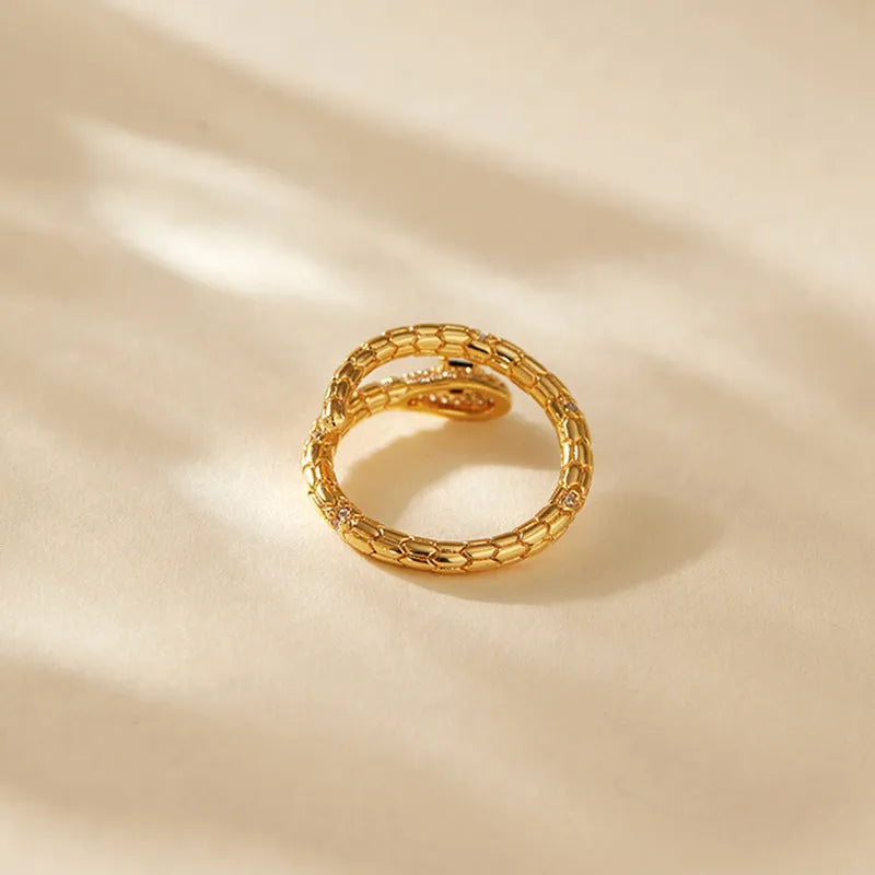 Adjustable snake-shaped copper index finger ring with 18K gold colour and diamond treatment