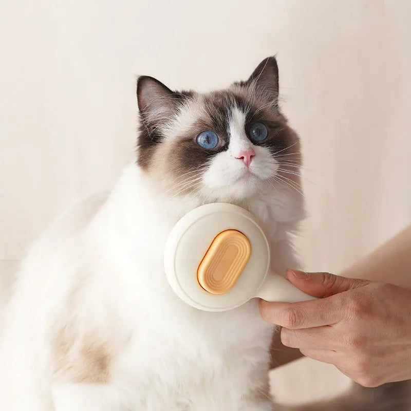 Green and yellow cat grooming brush with stainless steel comb and non-slip silicone handle.