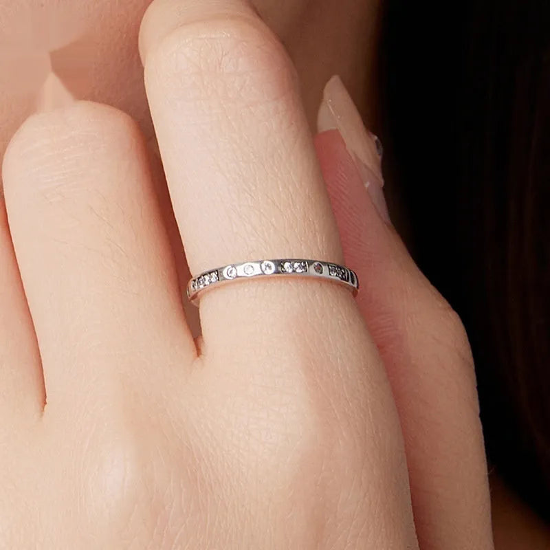 Moss Password I Love You silver ring with oxidised black finish, shown in size 7 on a model finger.
