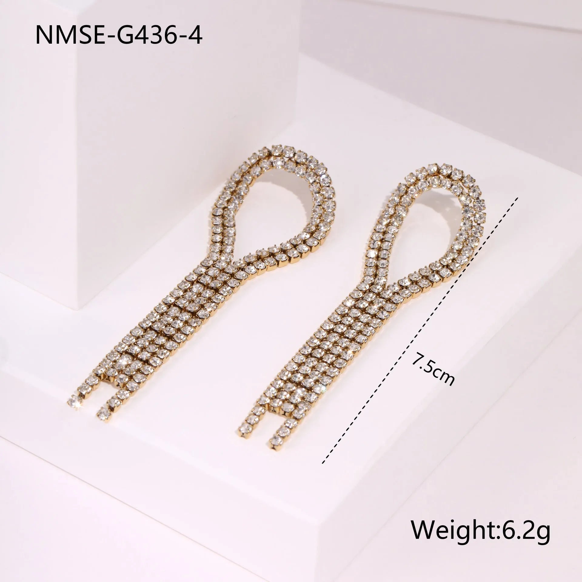 Stainless steel tassel earrings with 18K gold electroplated finish and diamond tips in heart and star shapes