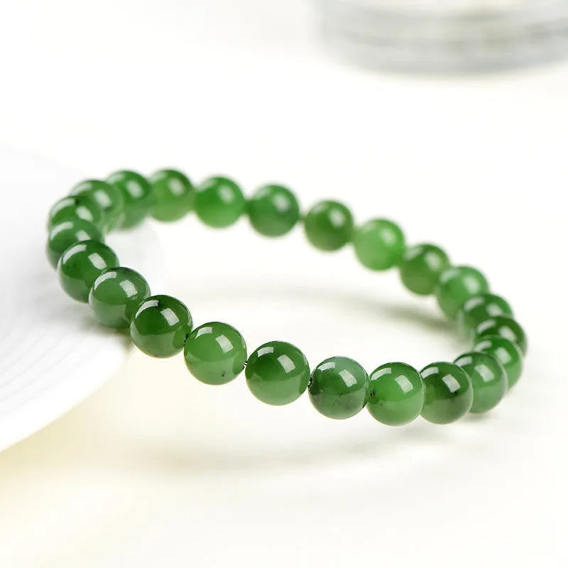 Natural jasper bead bracelet on wrist showing polished Hetian jade construction with multiple bead size options