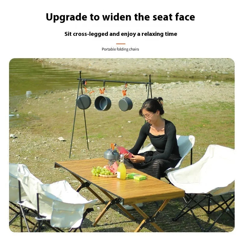 Beige folding camping chair with steel frame and Oxford cloth seat in open position