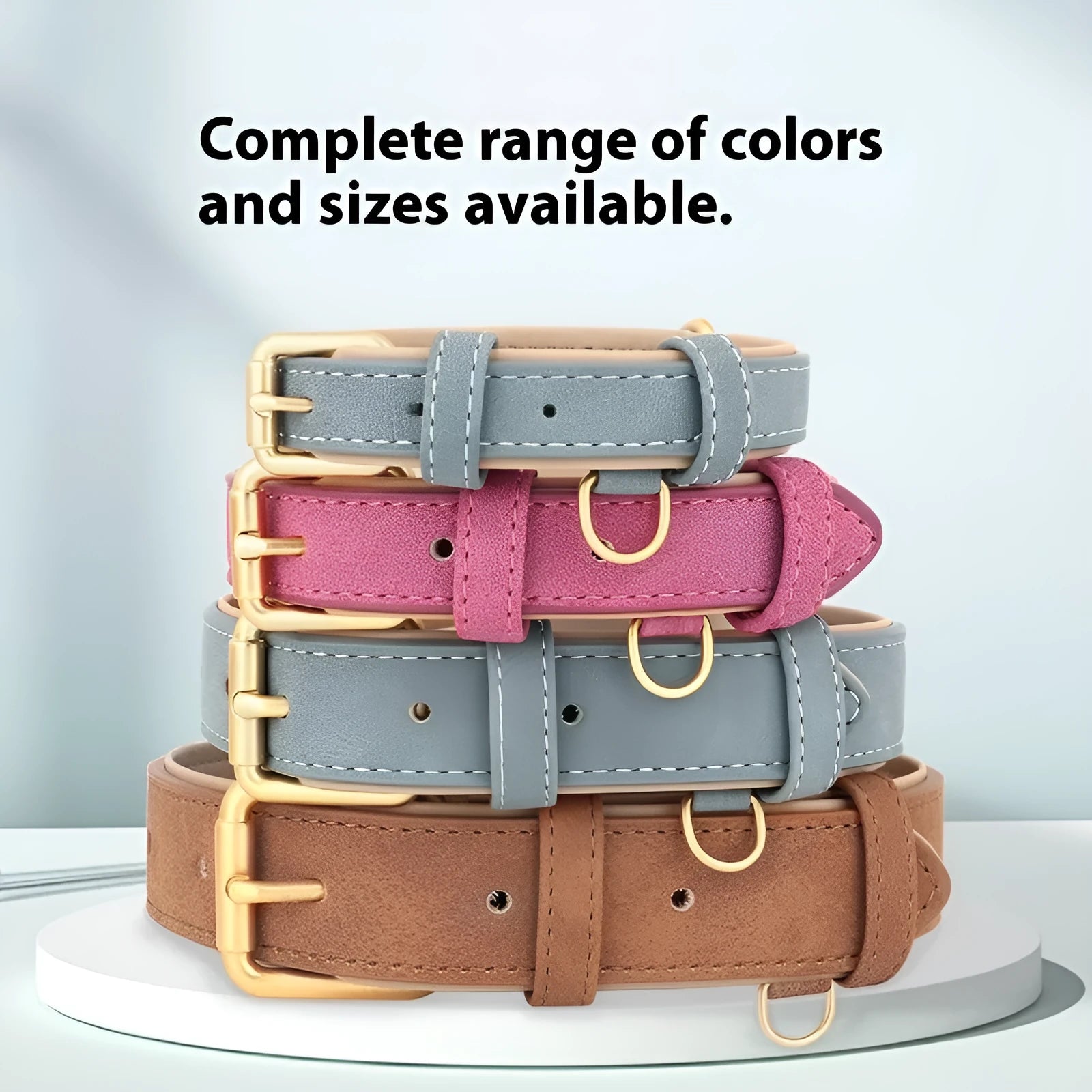 Blue double-layer leather dog collar and matching leash on a tan background