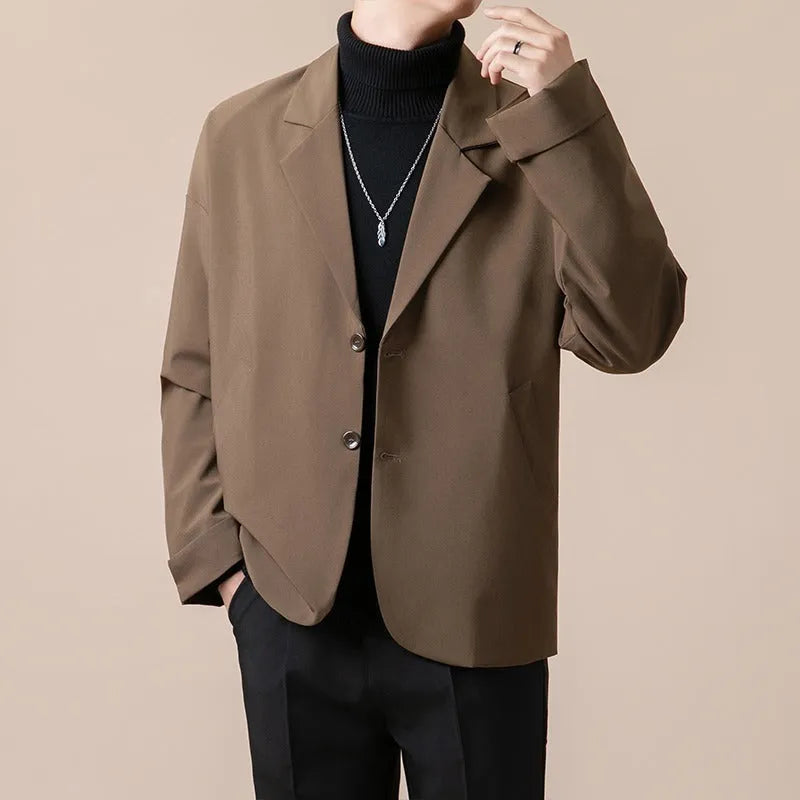 Loose fit light business suit jacket in chemical fibre blend fabric showing regular length and long sleeve design