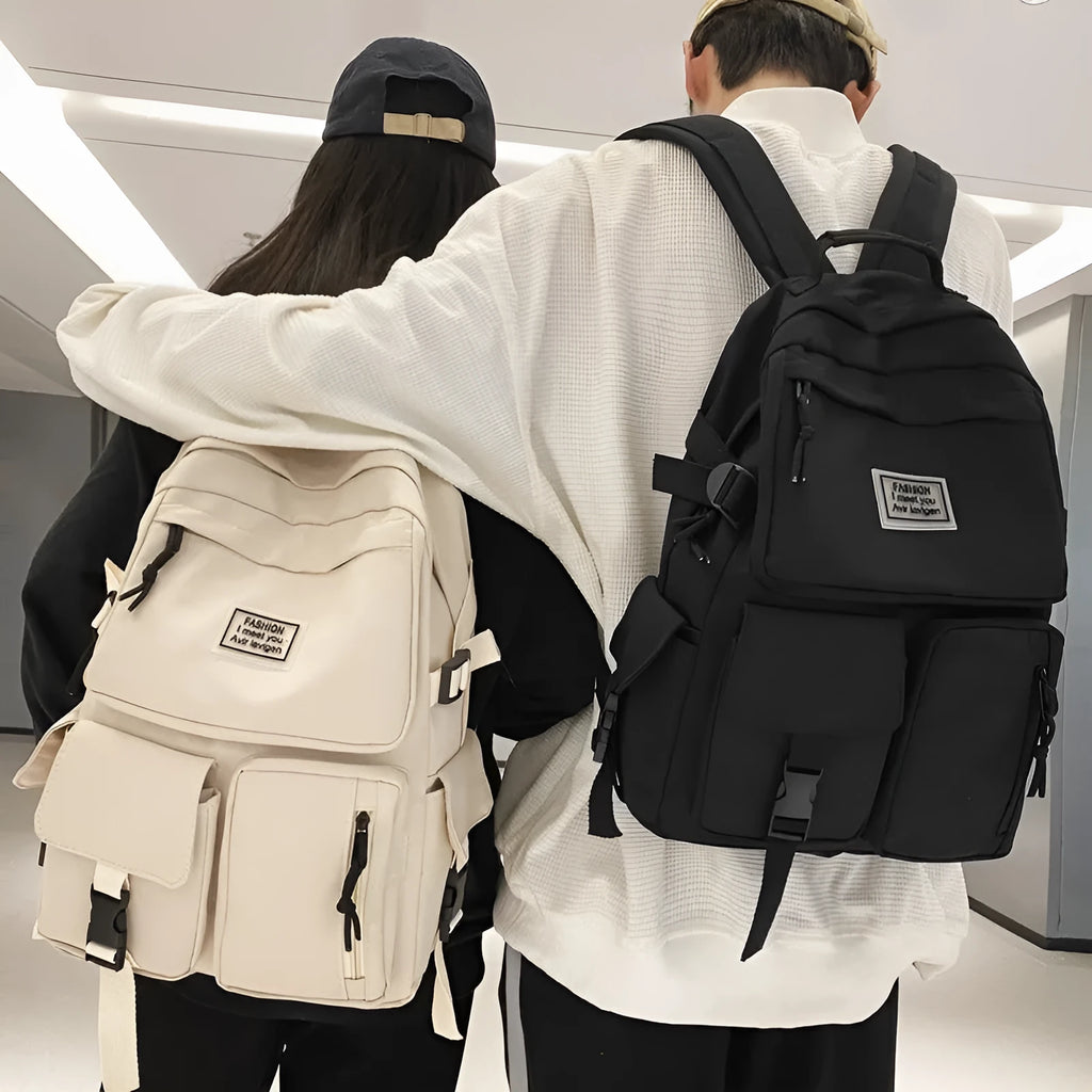 Black and white student backpack with computer compartment showing dimensions 31x12x41cm
