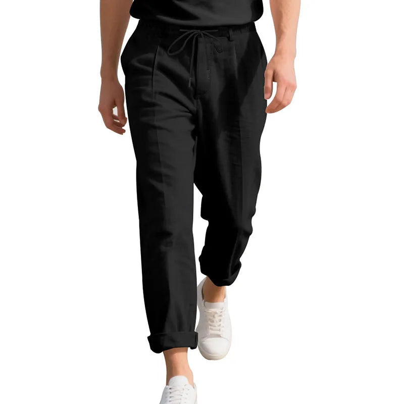 Men's light khaki linen casual trousers with a drawstring waist and straight-leg fit on a hanger.