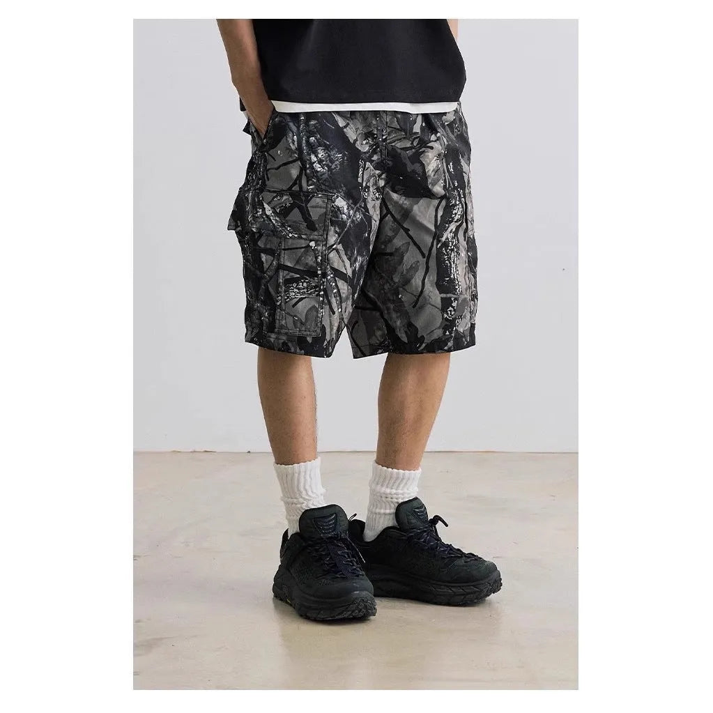 Loose straight-leg denim shorts in army green with a zip fly and elasticated mid-waist.