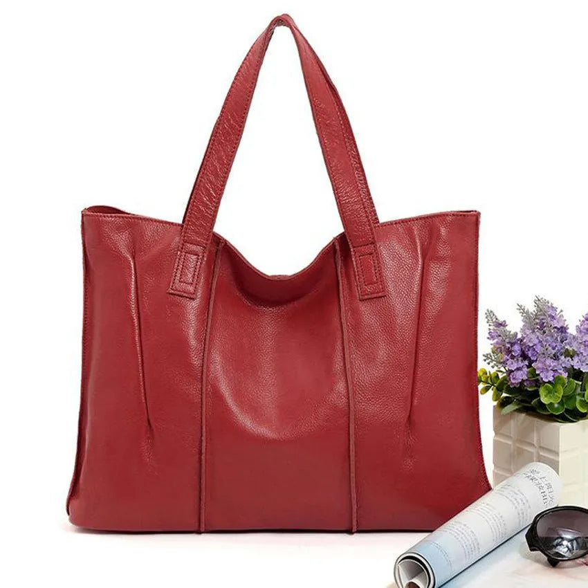 Top grain leather single shoulder tote bag in Apricot colour with stitching and patchwork design