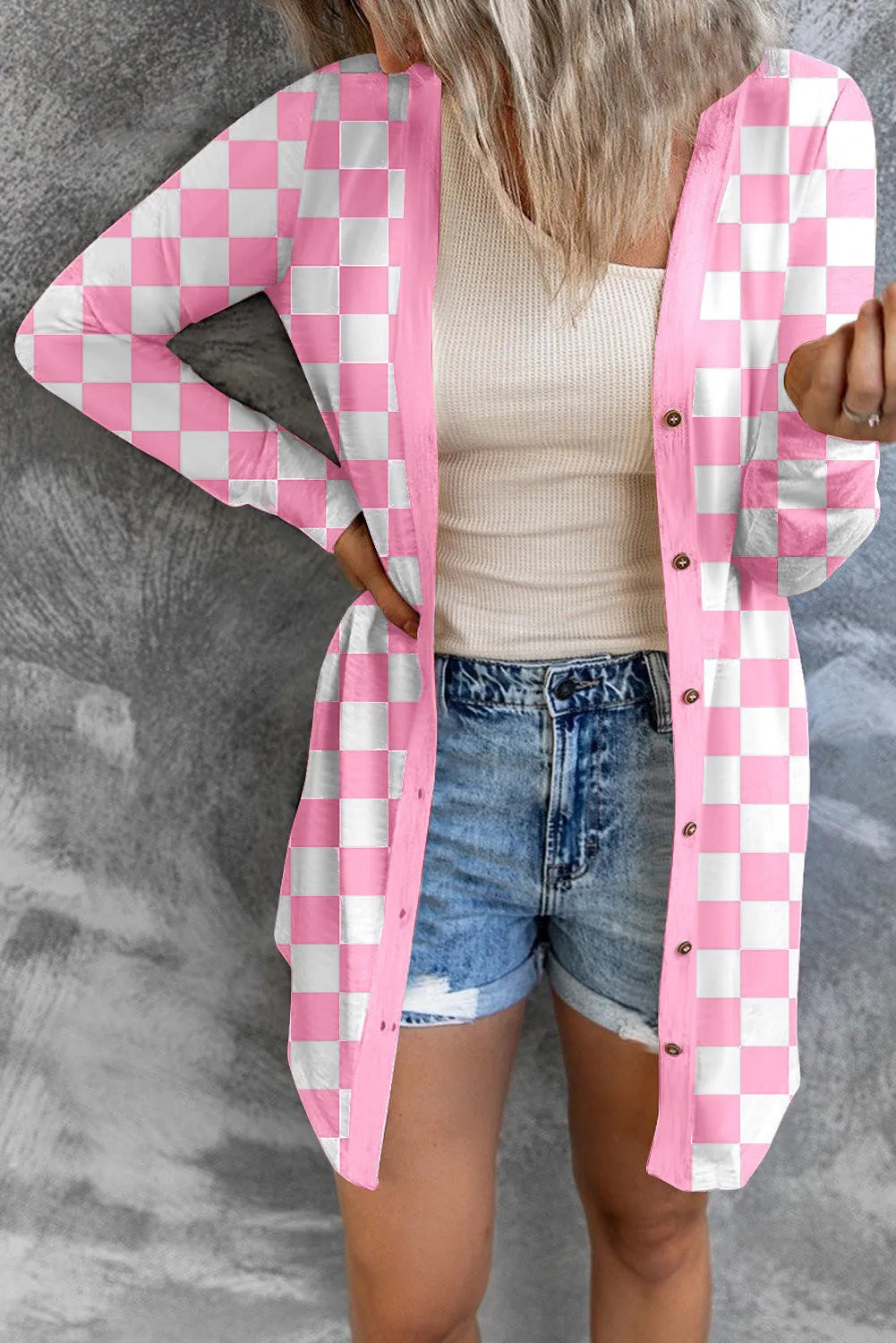 Women's long grey plaid knitted coat cardigan with contrasting colour blocks, loose fit, and regular sleeves.