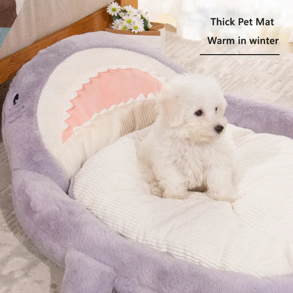 Blue shark pattern pet bed cushion for a small dog on a wooden floor