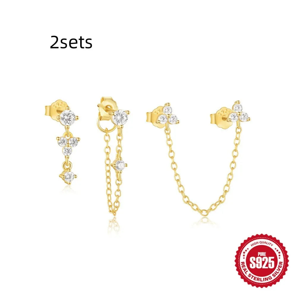 Three pairs of geometric zircon tassel earrings in sterling silver with gold tone variations