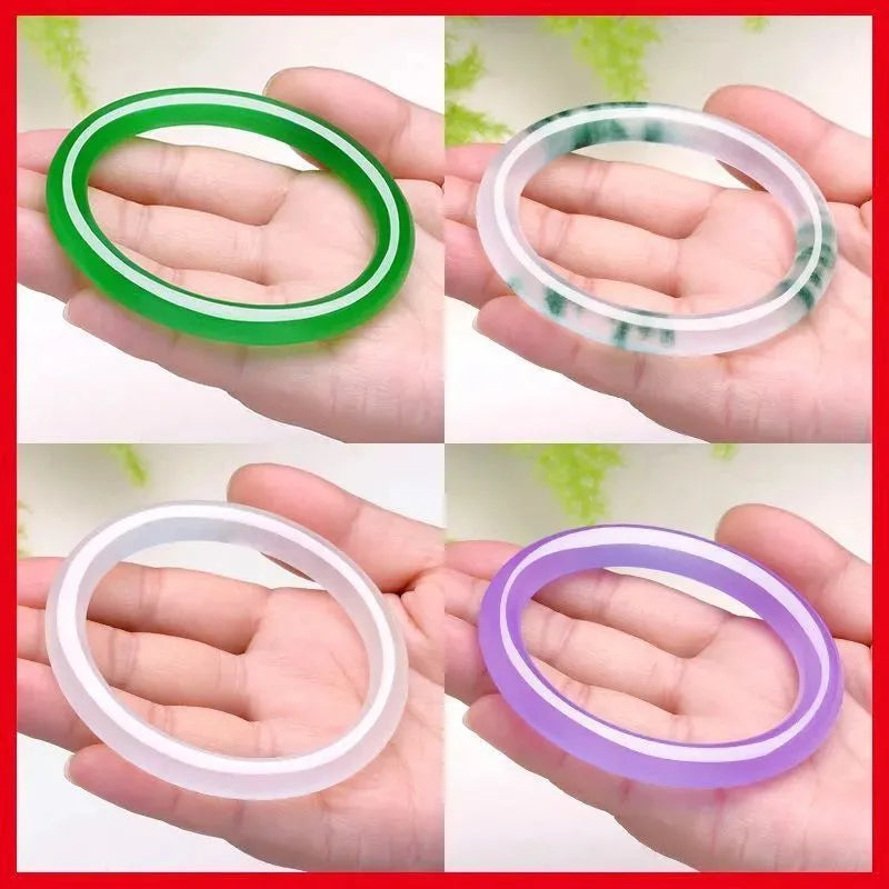 Jade bracelet with floating flower design and auspicious cloud patterns in ice-like emerald finish