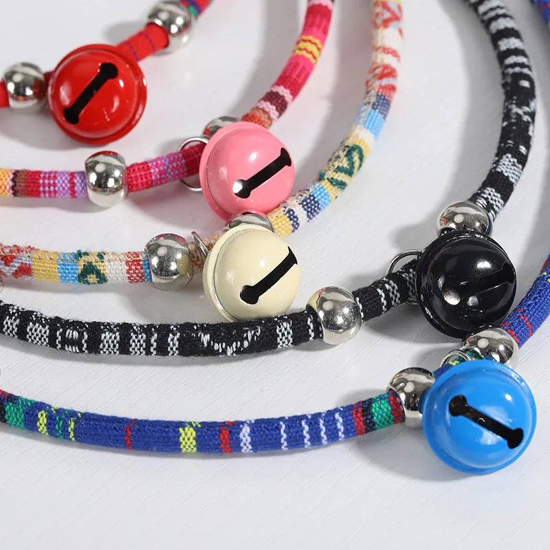 Ethnic style pet collar with bell necklace in five colours including black, blue, pink, red, and white