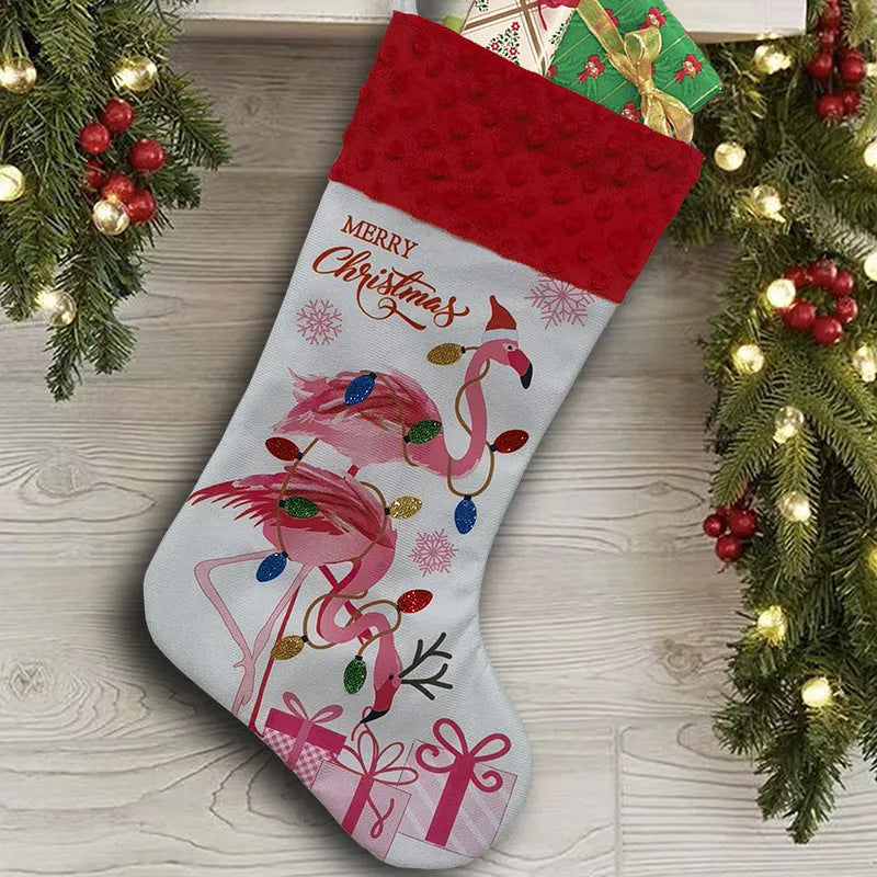 Red cloth Christmas stocking with flamingo design, 46cm long, hanging on fireplace.