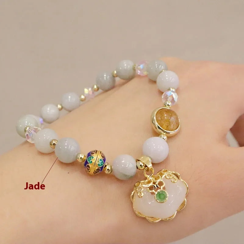 Geometric women's bracelet in gray Jade or Strawberry Quartz with three-dimensional ethnic metal decorations