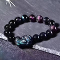 Natural ice colour Eye Obsidian crystal bracelet showing semi-translucent beads on wrist
