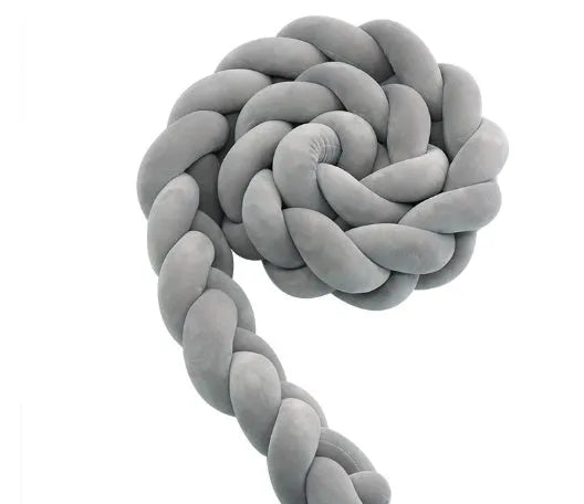 Braided knot crib bumper in spandex velvet, showing flexible length options for cot protection.