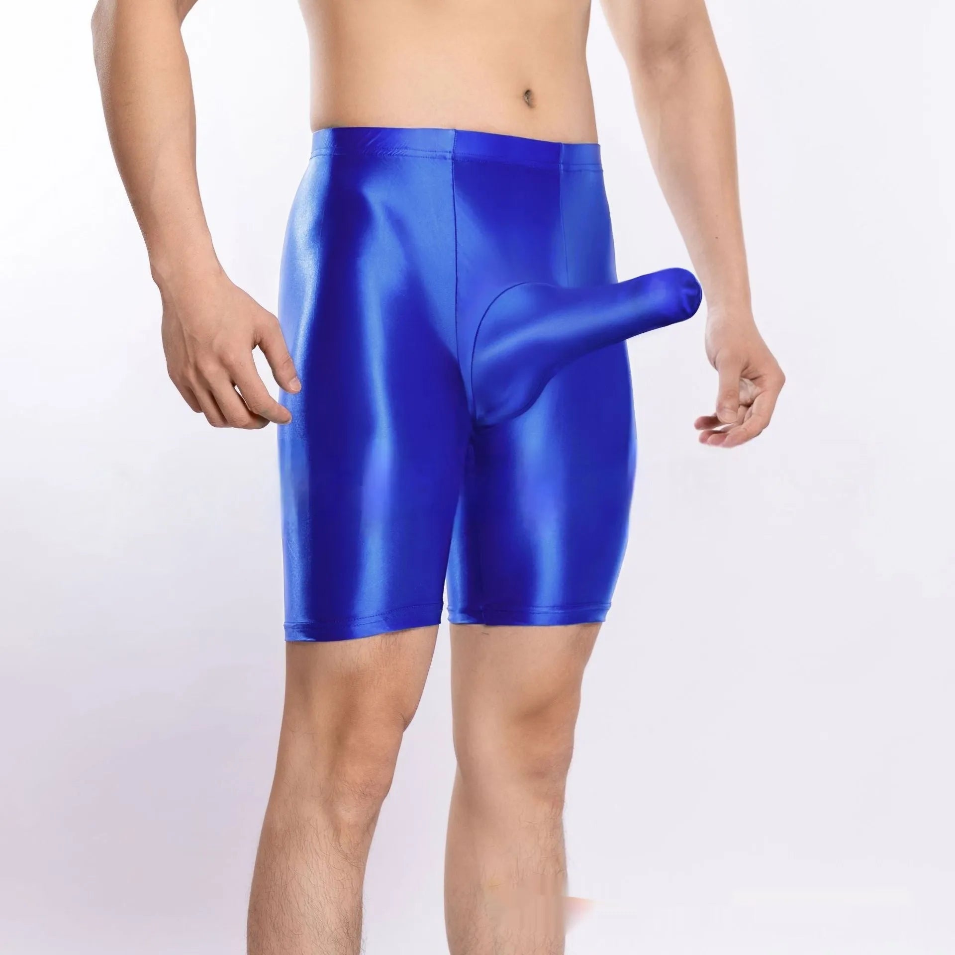 Man wearing shiny black plus size nylon sports shorts, showing silky finish.