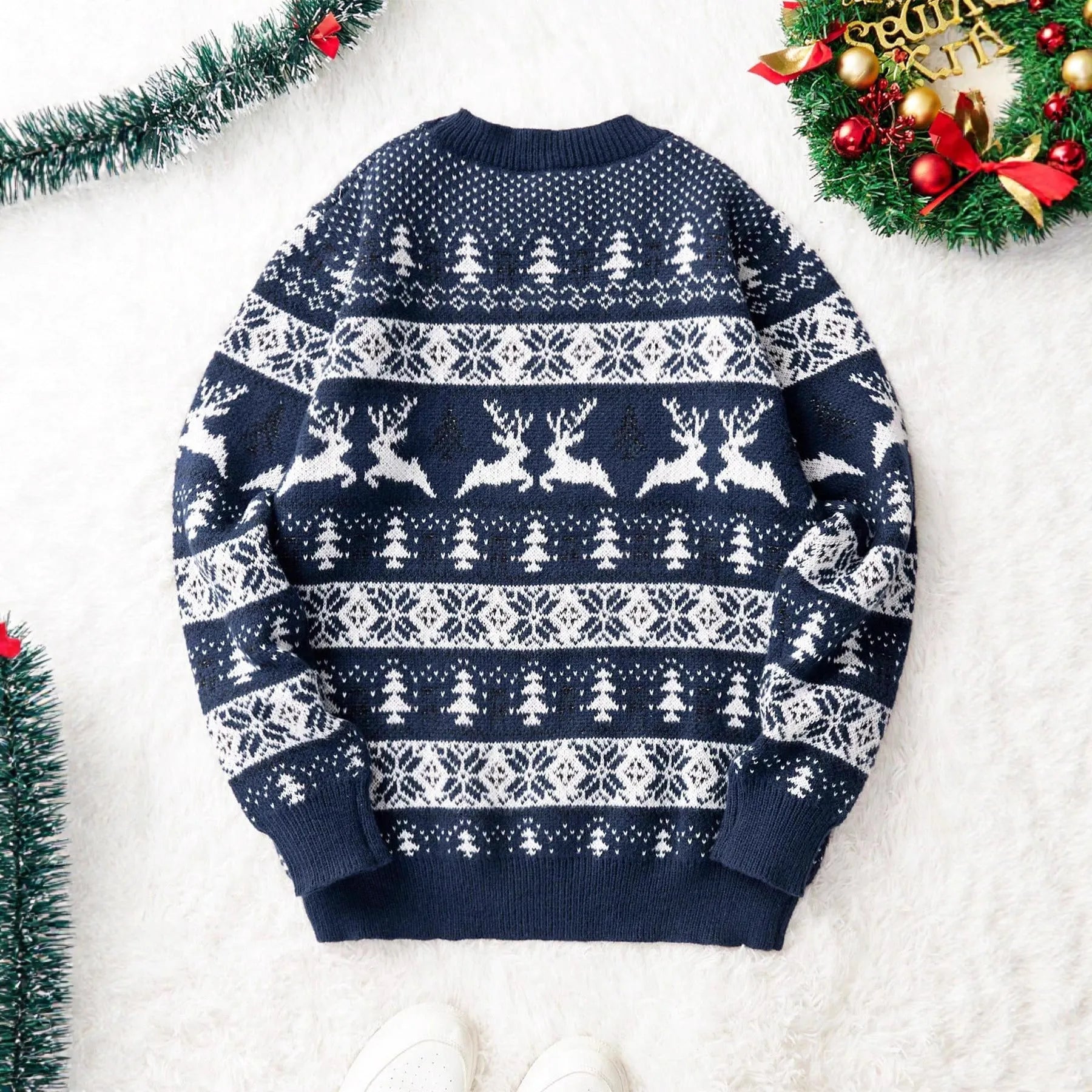 Men's red loose jacquard Christmas sweater with round neck and long sleeves on display