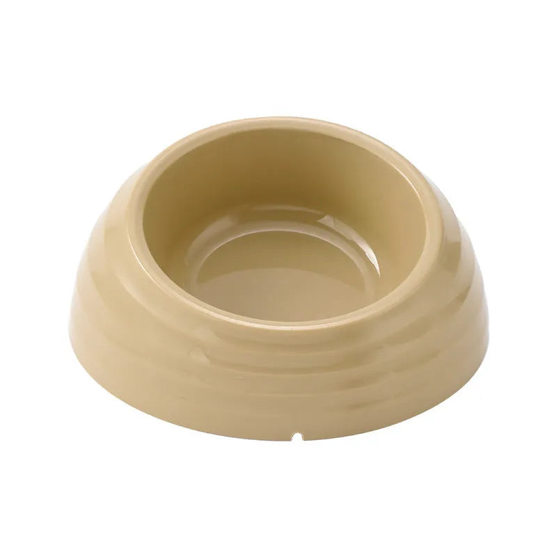 Stainless steel cat bowl on a plastic stand in light green, beige, or brown colour.