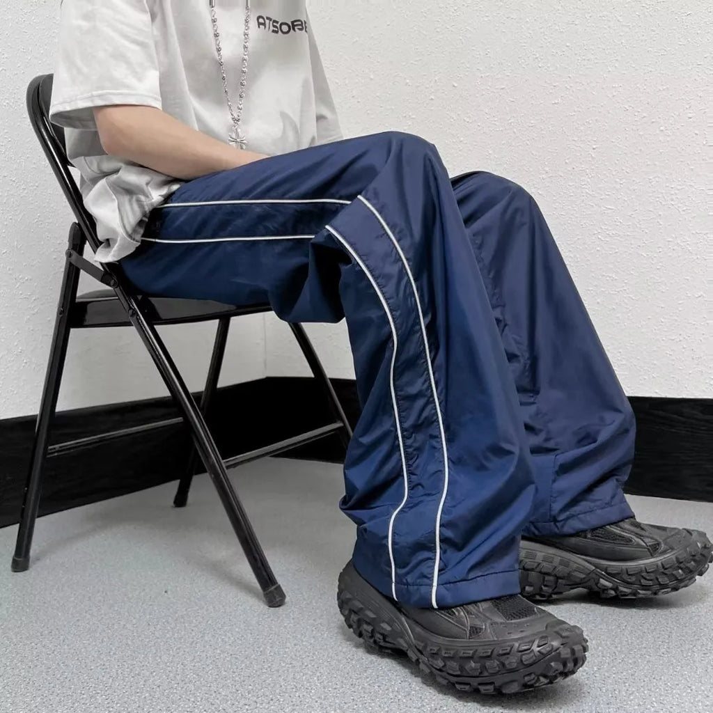 Men's navy blue wide leg striped casual pants made from lightweight polyester fabric, suitable for summer