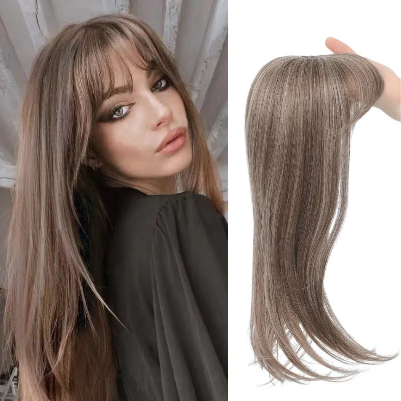 Synthetic high temperature fibre wig hairpiece with inner buckle and hair clip attachment in one of six colour styles.