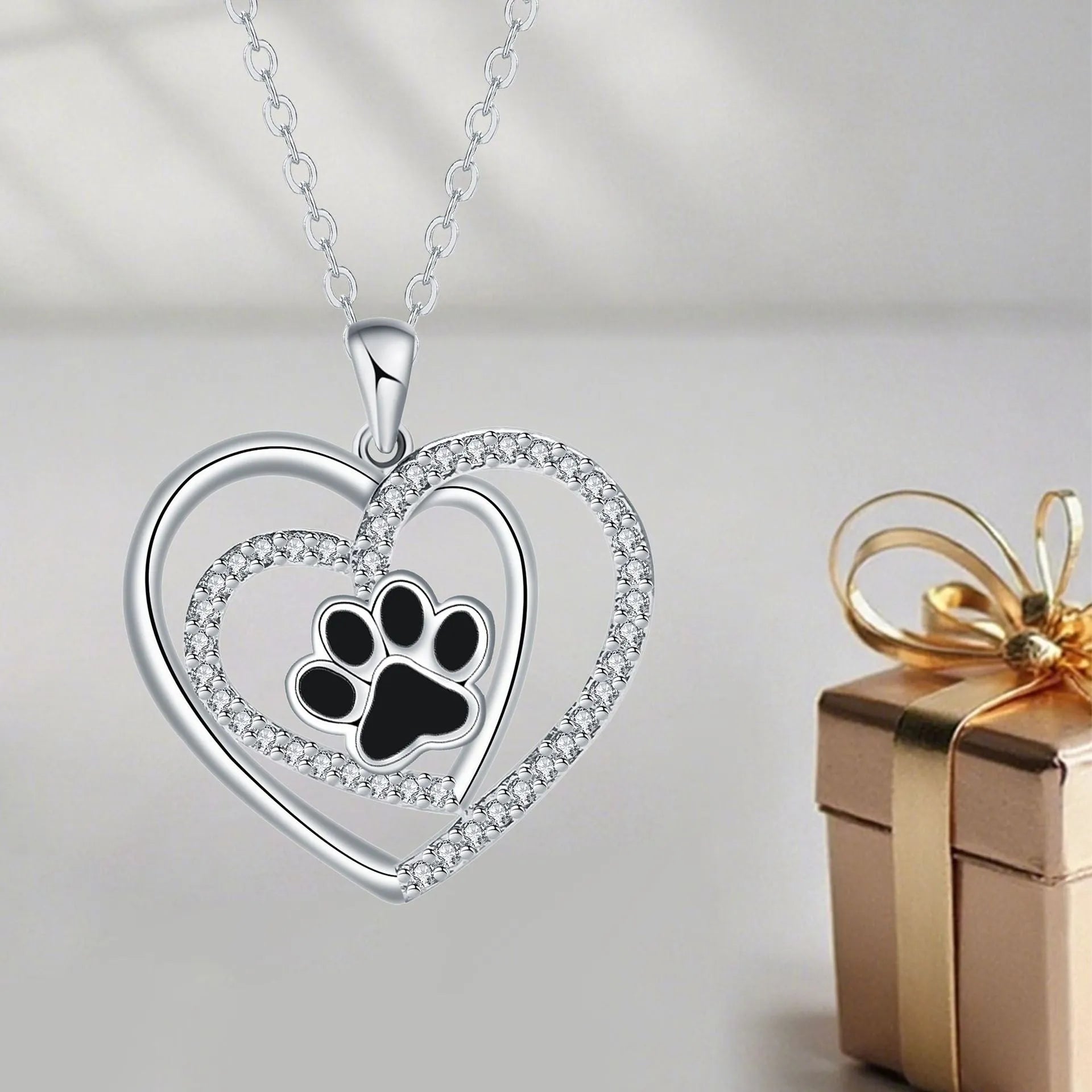 Dog paw print necklace with heart-shaped pendant on cross chain for women