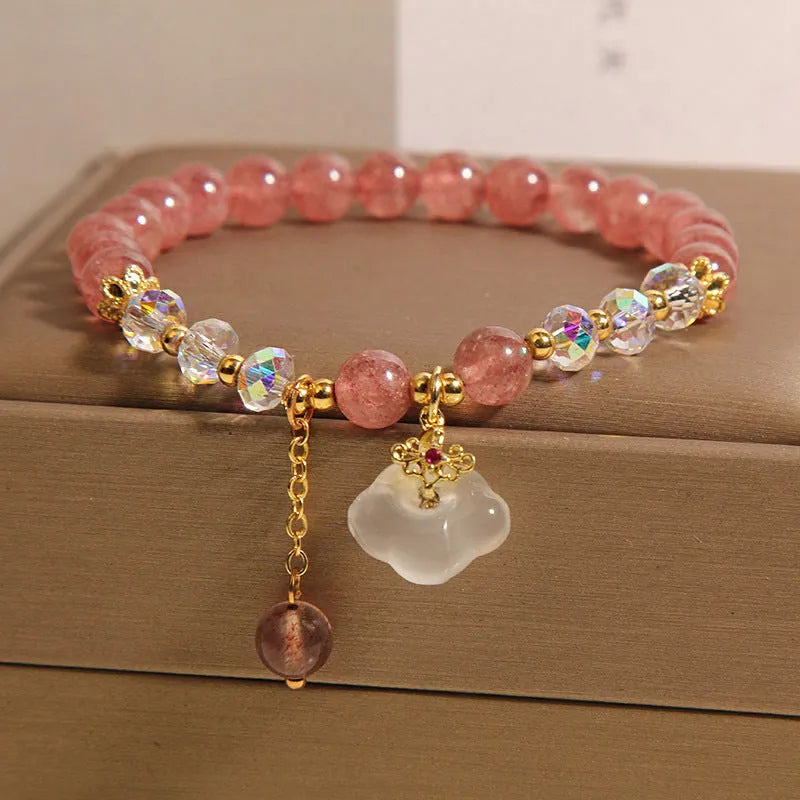 Women's adjustable crystal bracelet with strawberry quartz and white agate beads showing adjustable chain detail