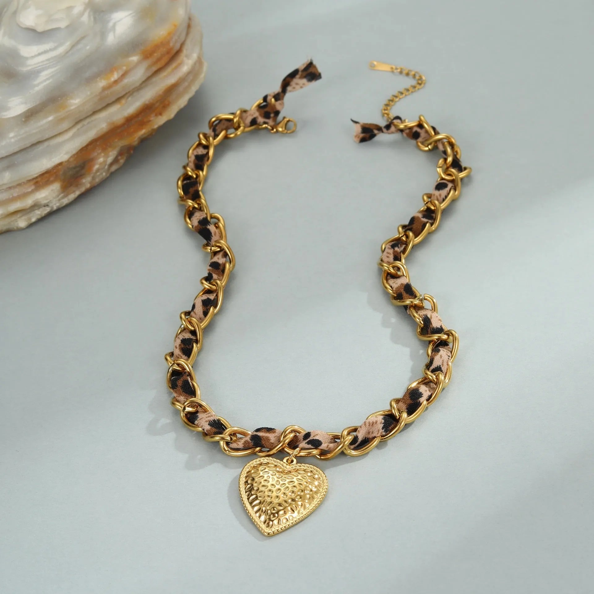 Gold-coloured stainless steel necklace with an adjustable chain and a choice of Big Heart or geometric Love Sun pendant.