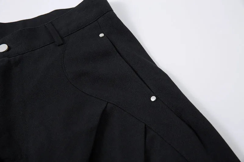 Men's black cotton loose-fit wide-leg trousers with machete pleats and an elasticated waistband
