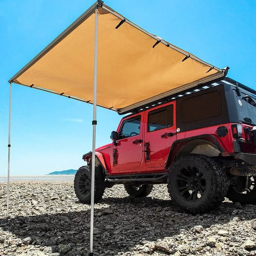 Camouflage car sunshade tent with aluminium poles set up outdoors, showing two-room interior.