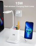 Wireless charging desk lamp with integrated pen holder and storage compartment in modern design